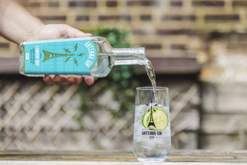 Antenna Gin London Dy 700ml being poured in to Antenna Branded Glass