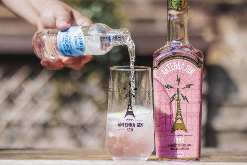 Antenna Gin Pink 700ml being poured in to Antenna branded glass